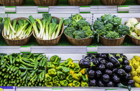 Fruits and vegetables on a supermarket shelf.の写真素材
