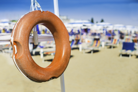 Safety equipment on the beach.Life jacket and beltの写真素材