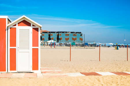 Red wooden cabins on the beach.の写真素材