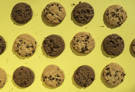 Biscuits on yellow background. Day lightの写真素材