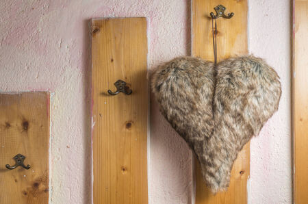 Heart shaped leather on hangerの写真素材