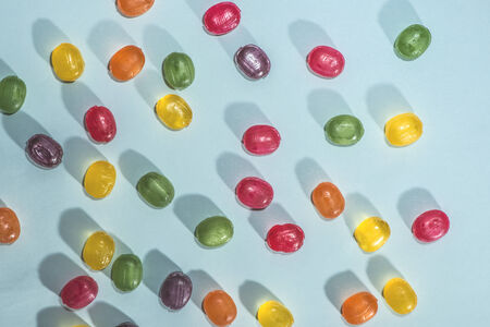 Candy scattered on the wooden tableの写真素材