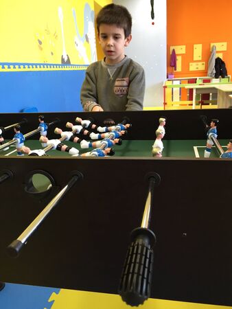 Child play foosball in playground