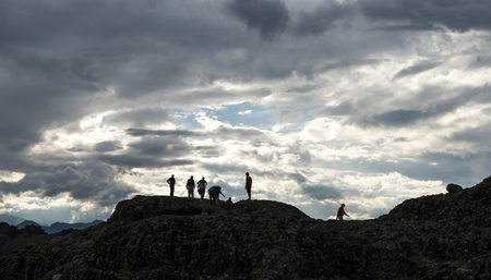 People on the top of the rocks. Cloudy sky. Greece, Meteoraのeditorial素材