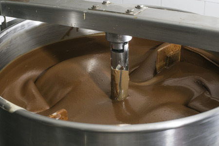 Machine for mixing chocolate. Close upの写真素材
