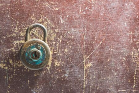 Old vintage padlock on wooden backgroundの写真素材