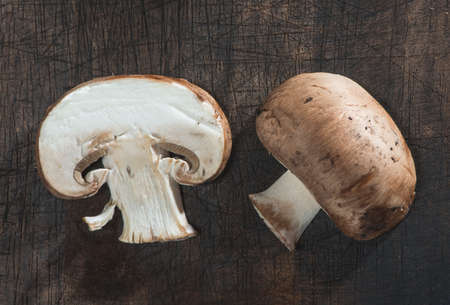 Sliced mushrooms on wooden tableの写真素材