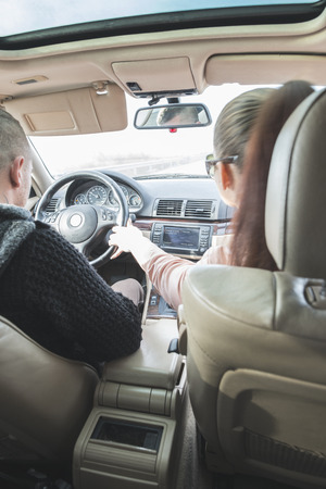 Â Young boy and girl driving a car. Car interiorの写真素材