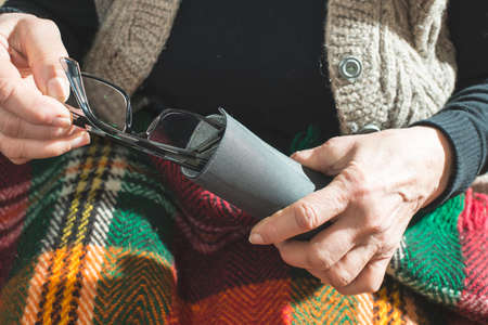 Old women hold glasses in pouchの写真素材