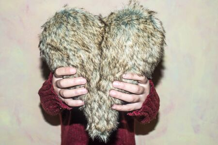 Women hold leather heart shapeの写真素材