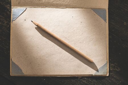 Vintage pencil and drawing paper. Weak sunlightの写真素材