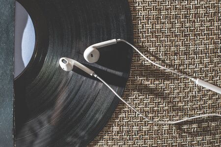 Smartphone and vintage LP. Close up