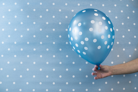 Balloon with white points on blue backgroundの写真素材