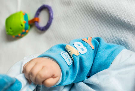 Baby hand adn text baby.