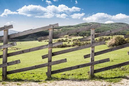 Wooden fence on a mountain ranch. Sunlightの写真素材