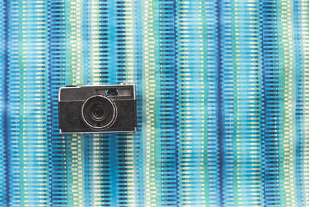 Vintage photocamera on blue paper background.の写真素材