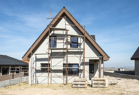 New build houses. Black roof, mountainの写真素材
