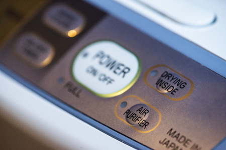 Air Purifier and dehumidifier. Concept for cleaning air and dehumidifying. Buttons on purifier...