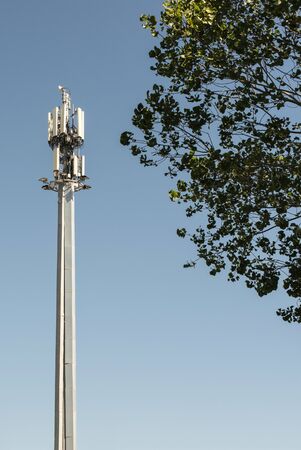5G antenna outside the city. GSM Antenna in the nature. New 5G technology for internet concept. New...