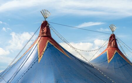 Blue dome of the circus and blue sky. Entertainment concept.の写真素材