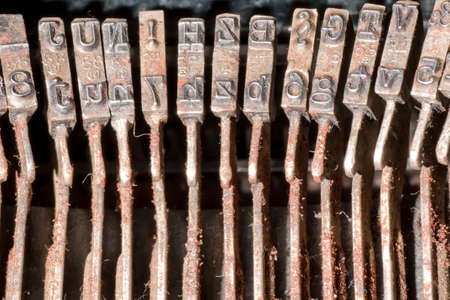 Old rusty typewriter type barsの写真素材