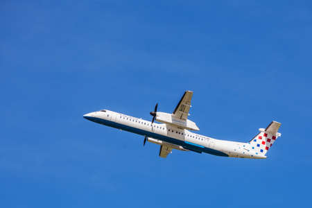 Croatia Airlines Dash-8 mid air, shortly after take-off from Zagreb Airportのeditorial素材