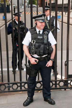 Security officers in front of the Downing Street 10, home of the Prime Minister of the United Kingdom of Great Britain. のeditorial素材