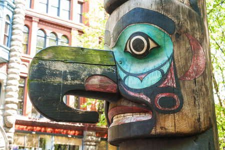 Face of Tlingit totem pole on Pioneer Square on May 19, 2007 in Seattle, Washington  Pioneer Square was city center where founders settled in 1852 のeditorial素材