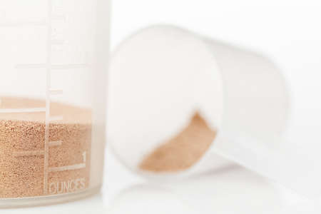 Shaker and protein powder isolated on white の写真素材