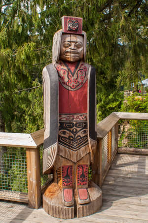 VANCOUVER, CANADA - MAY 23, 2007: Native Indian wood carving at the entrance to Capilano River Regional Park in District of North Vancouver, British Columbia, Canada. Park is home to 140 metres long and 70 metres Suspension Bridge over Capilano River. のeditorial素材