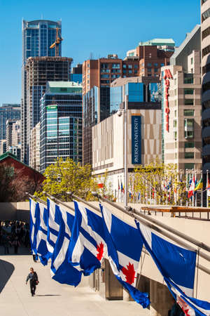 TORONTO, CANADA - MAY 4, 2007: Buildings in Toronto downtown, behind Natan Phillips Square, with flags of city of Toronto in the bottom.のeditorial素材
