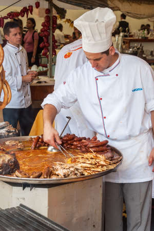 VARAZDIN, CROATIA - SEPTEMBER 2, 2007   Professional cook cooking during on the stand Spancirfest festival  It is street festival held every year since 1999 and lasts for 10 days, hosting over 100,000 tourists のeditorial素材