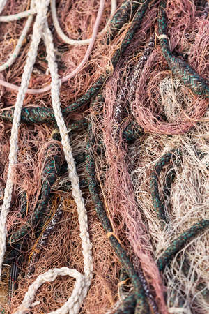Pink fishing net on the heap, closeup viewの写真素材