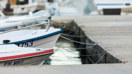 VELI IZ, CROATIA - AUGUST 15, 2014: Fishermen's boats parked and tied in city harbour in Veli Iz, on island Iz. Veli Iz is largest settlement on the island Iz.のeditorial素材
