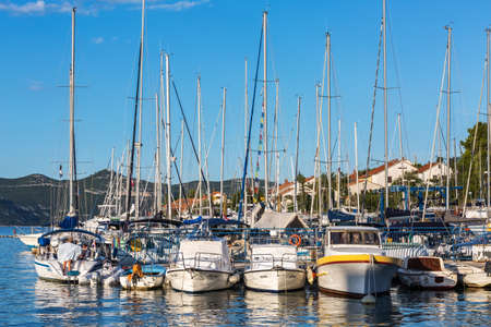 VELI IZ, CROATIA - AUGUST 15, 2014: Yachts parked and tied in the marina in city harbour in Veli Iz, on island Iz. Veli Iz is largest settlement on the island Iz.のeditorial素材