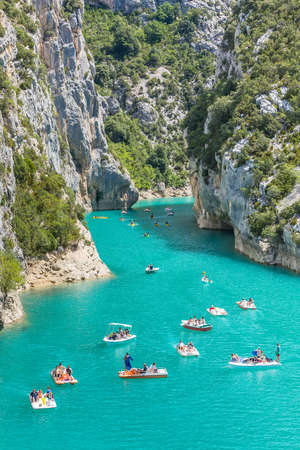 GORGES DU VERDON, FRANCE - AUGUST 15, 2015: People rowing during recreation in Verdon Gorge canyon,...