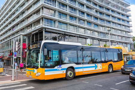 NICE, FRANCE - AUGUST 16, 2015: Public bus transport in front of Mercure Hotel on streets of Nice. Nice is 5th most populous city in France and capital of Alpes Maritimes department.のeditorial素材