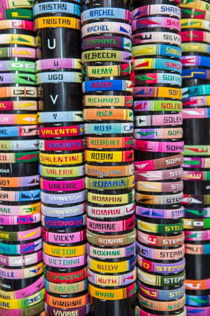 NICE, FRANCE - AUGUST 16, 2015: Handmade jewelry with male and female names at the street shop in Nice. Nice is 5th most populous city in France and capital of Alpes Maritimes department.のeditorial素材