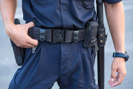 Policeman's belt with gun and handcuffs