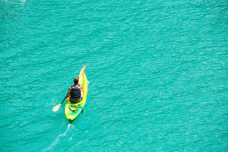 Man kayaking and recreating in Verdon Gorge, on mouth of Le Verdon river, near Aiguines. Canyon is about 25 kilometres long and up to 700 metres deep.の写真素材