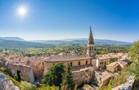 Fisheye view at St. Etienne church and houses in Saint-Saturnin-les-Apt, France from the castle above the villageのeditorial素材