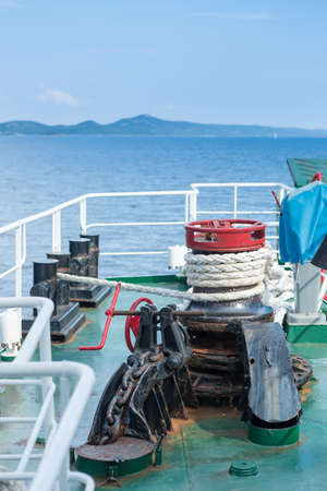 Pulley for pulling anchor with rope; on the front side of the ferry, in Adriatic seaの写真素材