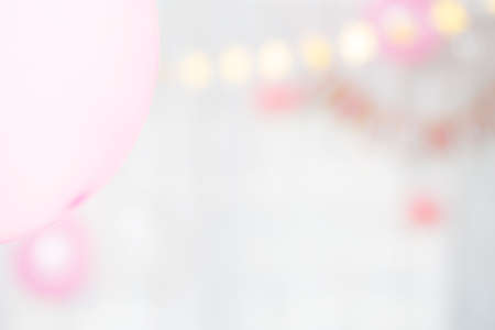 Abstract blurred background with defocused image of pink and white baloonsの写真素材