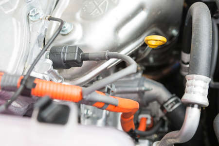 Parts of the engine of a hybrid car powered both by electric battery and gasの写真素材