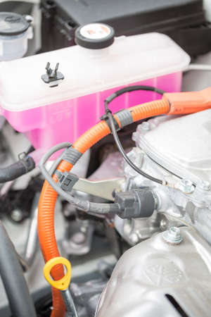 Parts of the engine of a hybrid car powered both by electric battery and gas