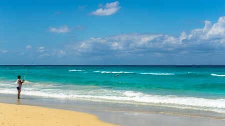 Fisherman at the Beachの写真素材