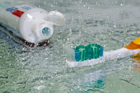 Image toothbrush with a splash of water and reflectionの写真素材