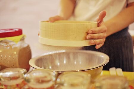 Woman a hand kneading dough, close-up photo
