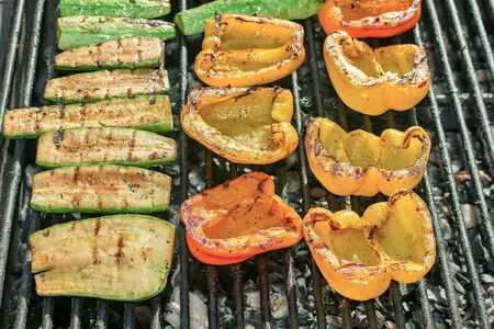 Charcoal Grill with vegetables. Peppers, zucchini and cucumber