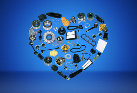 Heart spare auto parts for car on blue background. Set with many isolated items for shop or...